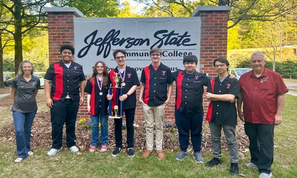 Pictured Left to right: Mrs. Shila Miller, Grey Stephens, Wren Gaines, Christopher Holder, Bronner Skaggs, Andrew Nguyen, Alvinh Nguyen and Col. Wayne Davenport